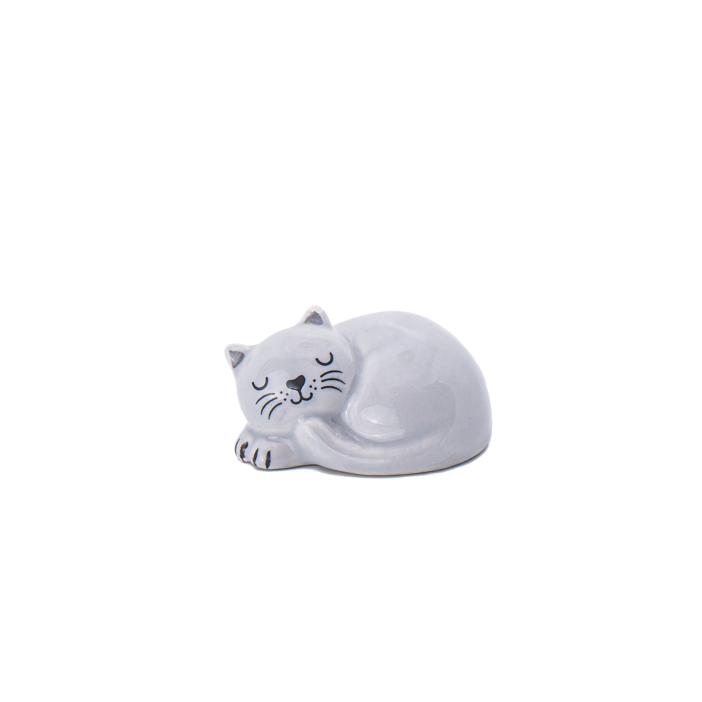 Token en forma de gato blanco durmiente y sonriente sobre fondo blanco. 