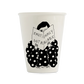 Vaso de porcelana blanca Sorry Not Sorry con ilustración de figura con traje de lunares negros leyendo un libro con texto Emotionally Not Available, vista frontal sobre fondo blanco