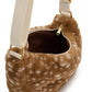Interior de la riñonera Andrea de Hindbag con forro marrón, cremallera abierta y detalle de la correa beige con herrajes dorados.