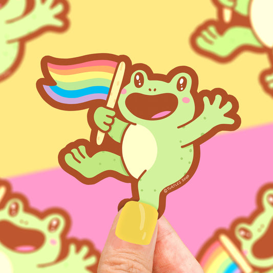 Pegatina con forma de rana ondeando una bandera del orgullo LGTBIQ+