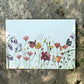 Postal con ilustración en acuarela de flores silvestres de Marialu Gili