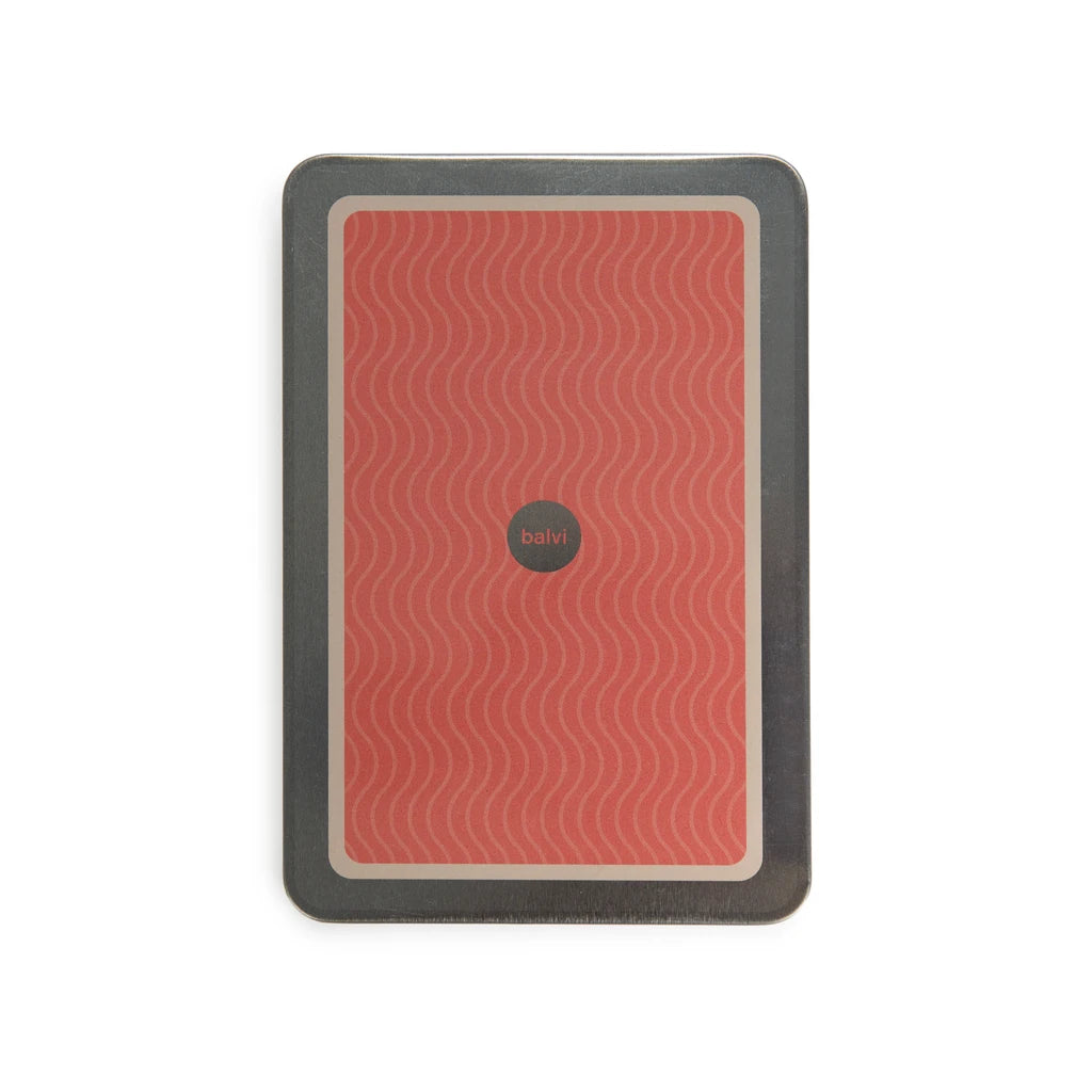 parte de atrás de la libreta en forma de lata de conservas en color rojo salmón con ondas en color blanco y el logo de la marca balvi en el centro