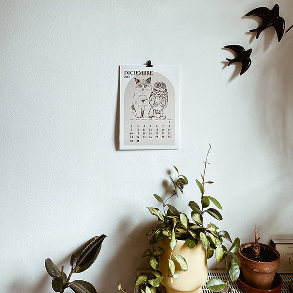 hoja de diciembre del calendario de pared de laura agusti con ilustraciones de Gatos