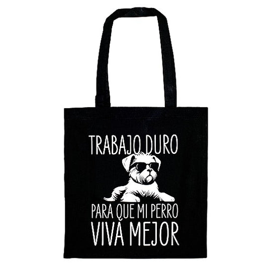 totebag de tela de color negro con el texto trabajo duro para que mi perro viva mejor, en color blanco.  Y un dibujo de un perro