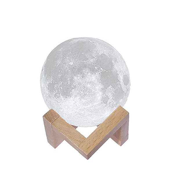 Lámpara de led con forma de luna sobre un soporte de madera con tres tonos de luz