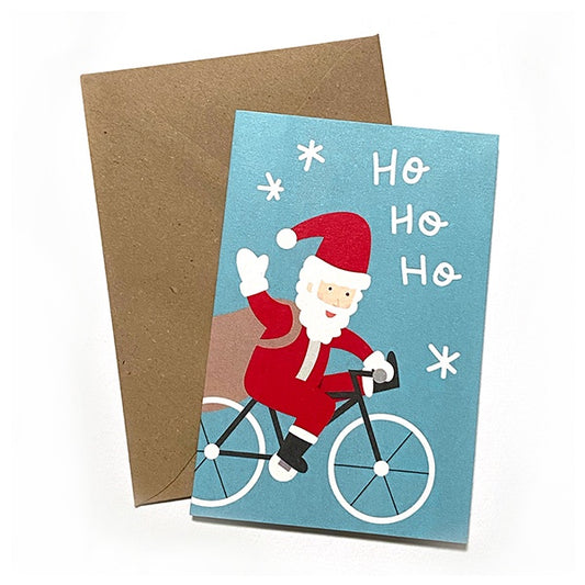tarjeta de Navidad con ilustración de Papá Noel en bicicleta de Elisa Talens y sobre craft