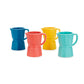 Juego de cuatro tazas de café expreso solo de cerámica de diferentes colores: azul, rosa, amarillo y turquesa