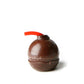 Bombón de chocolate relleno de anís con mecha de regaliz con forma de bombeta, un petardo clásico de las Fallas de Valencia